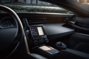 Ultra-realistic iPhone 16 Pro photo, 24mm equivalent, f/1.8, shallow depth of field, natural morning light: an empty parked car interior with no people. On the passenger seat: a plain white envelope labeled “Medical Institute for Road Safety (מרב״ד) — Appointment Notice” and a folded information sheet titled “ADHD and Driving — When Is a Summons to the Medical Institute for Road Safety Required?”, next to a generic driver’s handbook and a set of car keys. Soft sun through the windshield, clean upholstery, subtle reflections on the dashboard, crisp textures, true-to-life colors, Smart HDR, believable shadows. No logos, no personal data, no faces, no body parts.